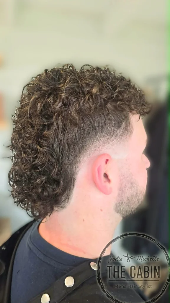 Men's curly mullet perm with skin fade